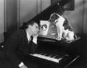 man-asleep-piano-dog-52009621.jpg