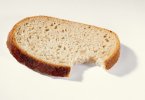 00931076-A-slice-of-bread-with-a-bite-taken.jpg