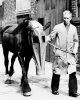 09 leading a horse in a gas mask through a street.jpg